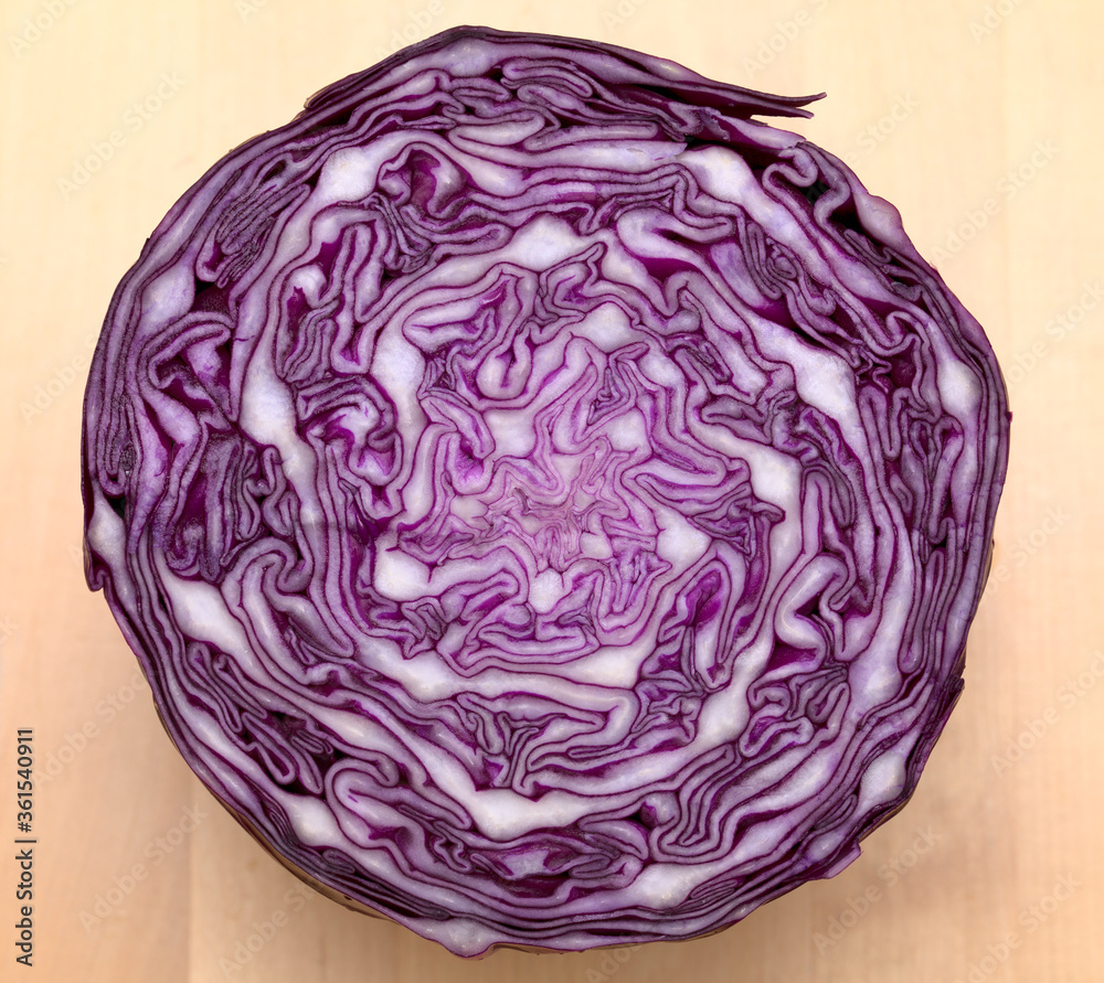 Red Cabbage cut, with inner patterns of folded leaves visible Red Cabbage cut, with inner patterns of folded leaves visible