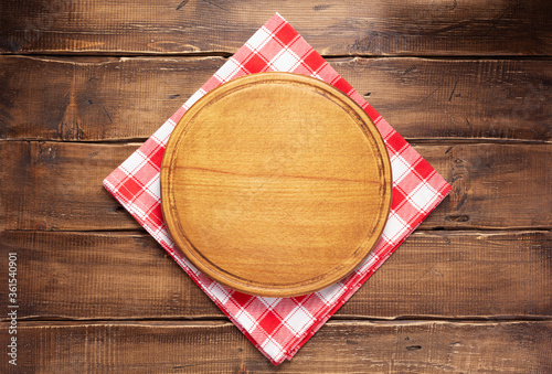 table cloth napkin ant pizza cutting board on wooden background