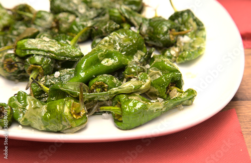 Classic Spanish tapa - fried small green peppers with sea salt
