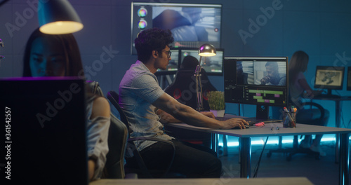 Video editors at work in editing room
