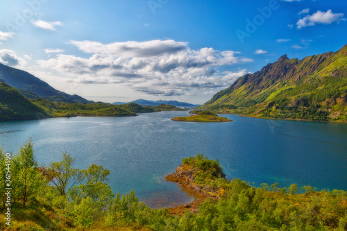 Beautiful summer Norwegian landscape with a lake and mountains © Shchipkova Elena