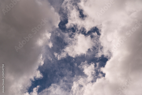 blue background sky and atmospheric white clouds