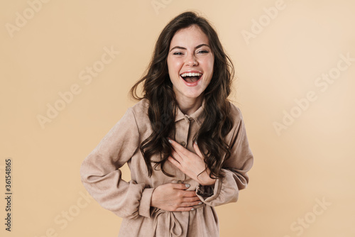 Image of cheerful brunette nice woman laughing on camera