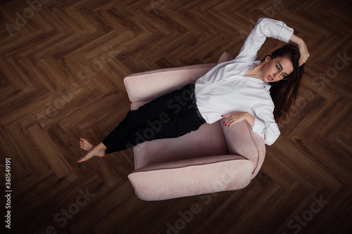 young woman sitting on a chair