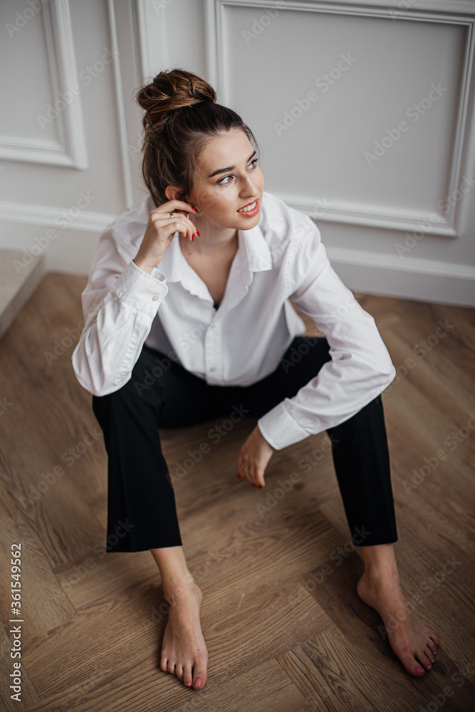 young woman sitting on the floor young woman sitting on the floor