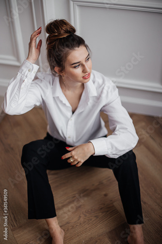 young woman sitting on the floor