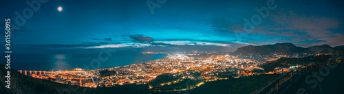 Terracina, Italy. Top View Skyline Cityscape City In Evening Night Illuminations. Panorama, Panoramic View