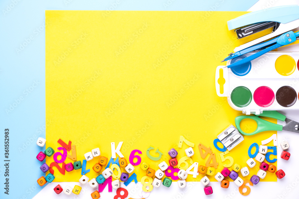 Fototapeta premium Many different school supplies on yellow copy space background. Back to school concept.