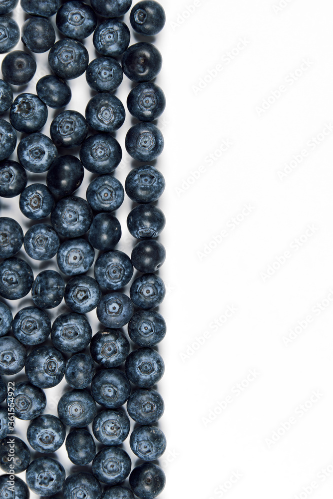 nature and healthy food concept - Top view of fresh blueberries isolated on white background. Copy space. nature and healthy food concept - Top view of fresh blueberries isolated on white background. Copy space.