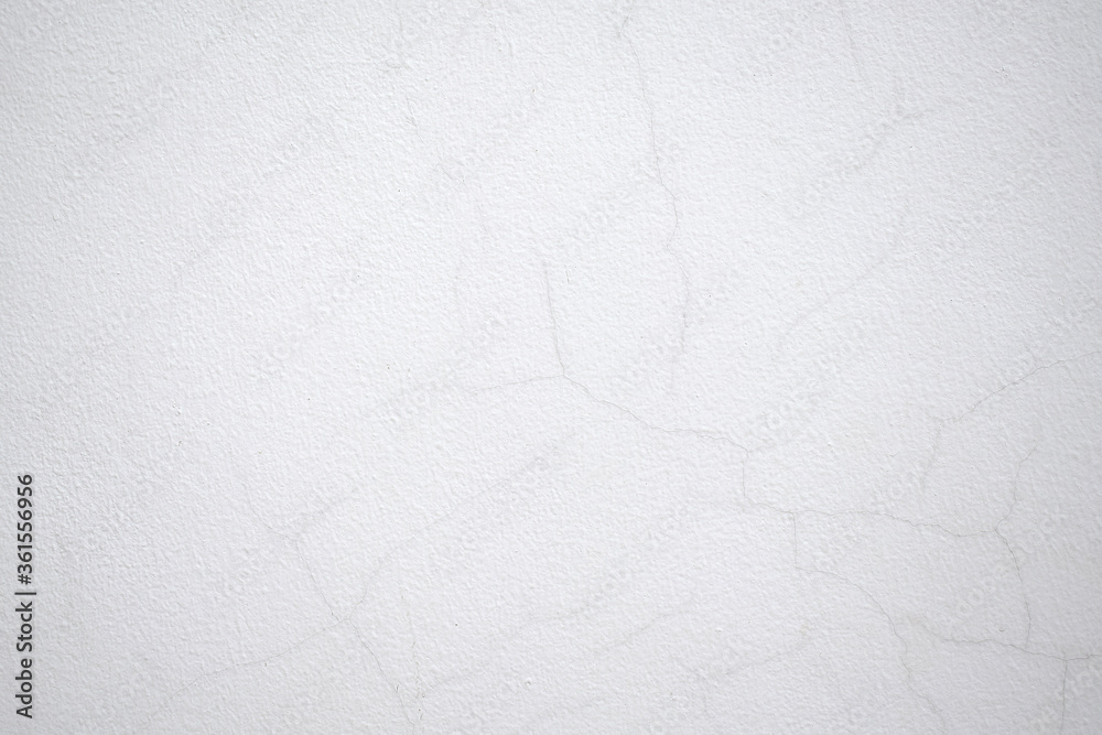 Obraz premium White cracked cement wall surface