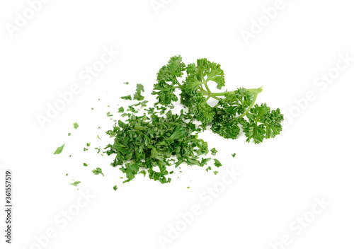 pile of chop fresh  parsley and branch parsley on white background