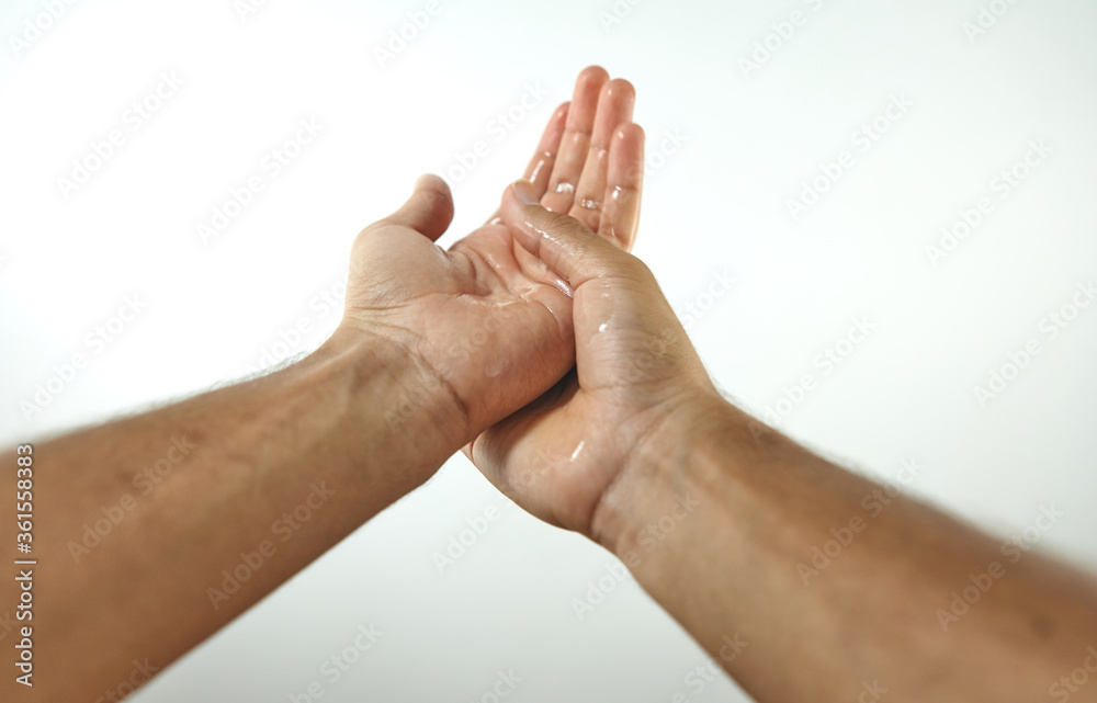 hands disinfecting with hydroalcoholic gel hands disinfecting with hydroalcoholic gel