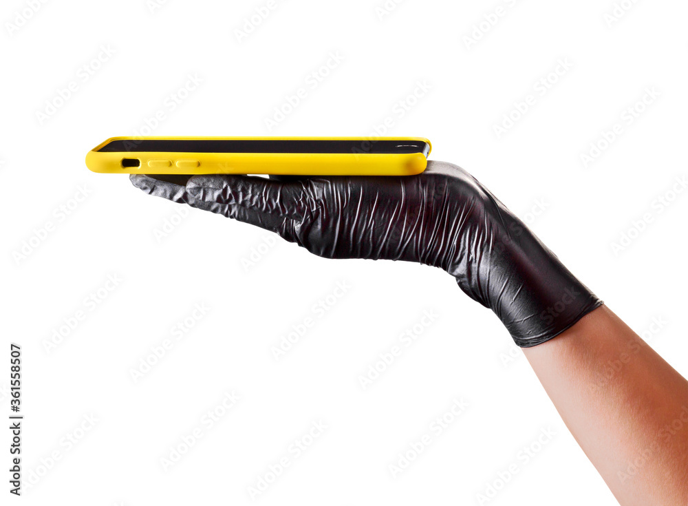 Obraz premium Hand in black glove holding mobile phone with blank screen isolated on white