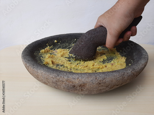 Mashed seasoning, from garlic, candlenut, salt and pepper. Handmade, traditionally made with stone mortar. Basic seasoning for various Indonesian cuisine