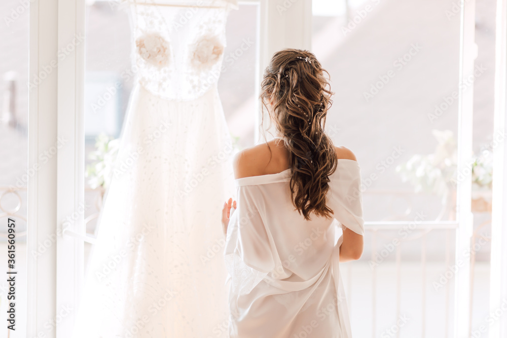 A magnificent wedding dress for the bride before the ceremony A magnificent wedding dress for the bride before the ceremony