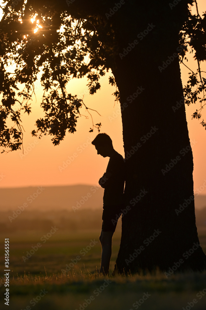 Portrait young man alone at sunset