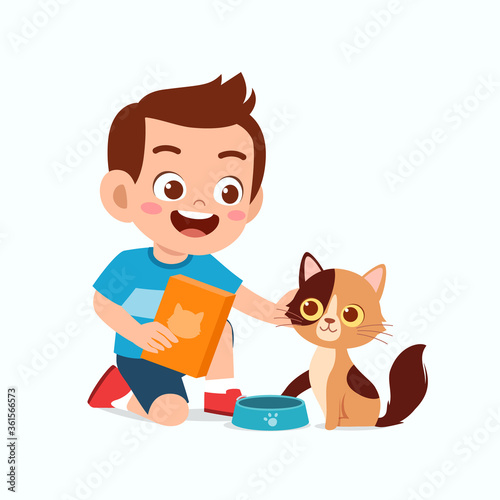 happy cute little kid boy play with pet cat