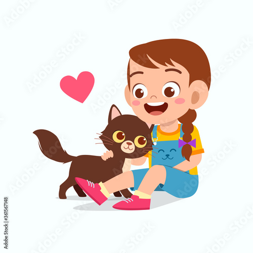 happy cute little kid girl play with pet cat