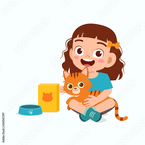 happy cute little kid girl play with pet cat