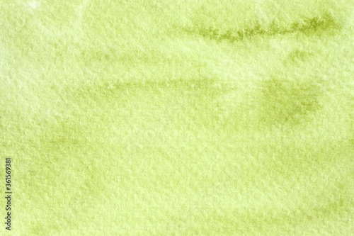 Abstract light green watercolor background, hand drawn painting on paper.