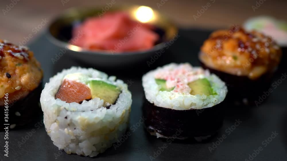 Sushi roll set on the black plate. Japanese food. Sushi roll set on the black plate. Japanese food.