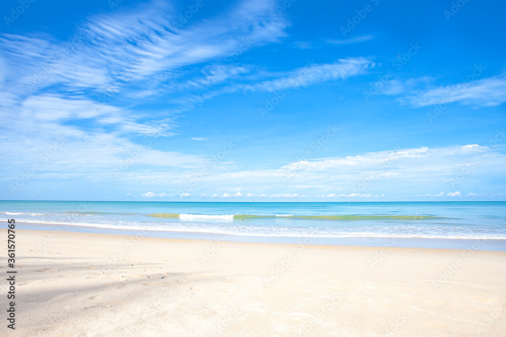 landscape of white sand beach with  blue sea and cloudy blue sky background for summer travel concept.