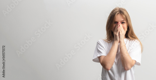 suprised young caucasian woman girl isolated on white background. banner. copy space
