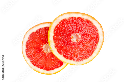 Two round slices of grapefruit Isolated on a white background. Citrus, red, orange, sour, juicy. Details close up.