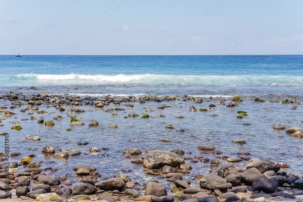 View on Indian ocean coast with pebble and sand beach on Bali, Indonesia View on Indian ocean coast with pebble and sand beach on Bali, Indonesia