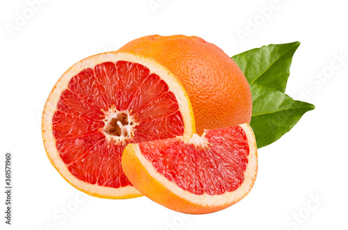 Composition of cut pieces of grapefruit with green leaves isolated on a white background. Whole unpeeled grapefruit. Citrus, red, orange, sour, juicy. Details closeup.