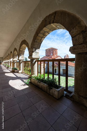 Byzantine Abbey of Pojan, Saint Mary Orthodox Church and Monastery viewed through arches, Apollonia Archaeological Park, Pojani Village, Illyria, Albania photo