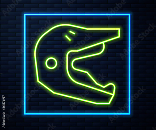 Glowing neon line Motocross motorcycle helmet icon isolated on brick wall background. Vector Illustration.