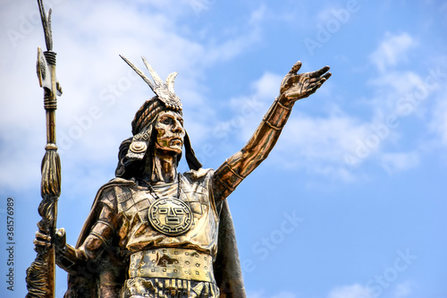close-up of statue of Inca Pachacutec in Cusco, Peru against blue sky photo