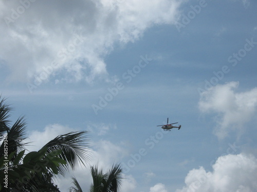 flying helicopter in sky