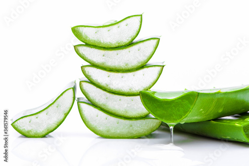 Green fresh aloe vera leaf with sliced isolated on white background.Natural herbal medical plant ,skincare ,health and beauty spa concept. 