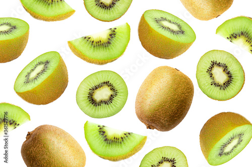Fresh organic ripe whole kiwi fruits and slices isolated on white background. Top view. Flat lay.