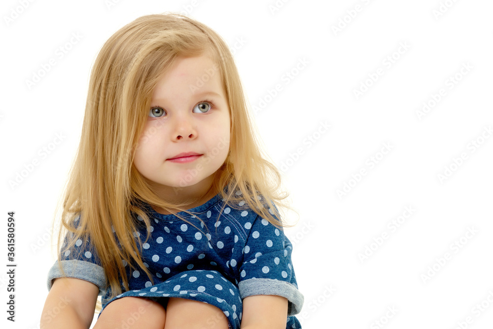 The little girl thinks.Isolated on white background. The little girl thinks.Isolated on white background.
