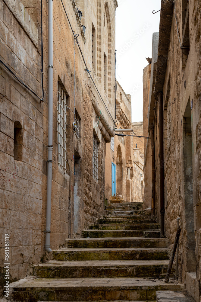 View of the narrow streets of the historic Mardin. Mardin, Turkey.