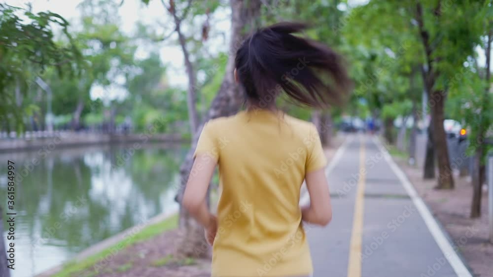 Young women running and exercising in the park. Young women running and exercising in the park.