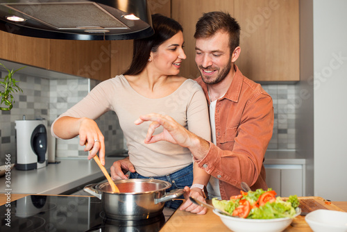 Couple cooking together in the kitchen