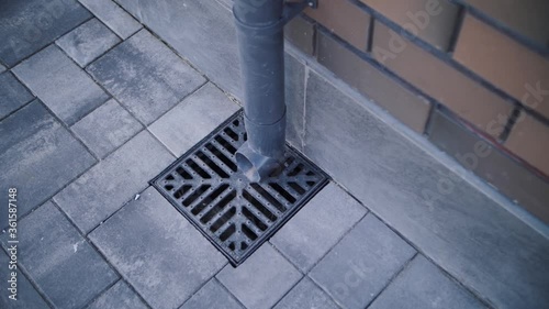 drainpipe on the background of the brick house