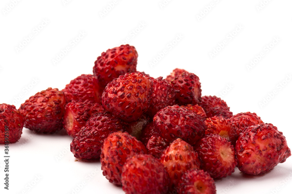 Macro view wild strawberry on white background. Forest red berries Macro view wild strawberry on white background. Forest red berries