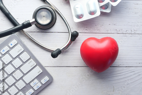  keyboard, heart, and stethoscope on white background 
