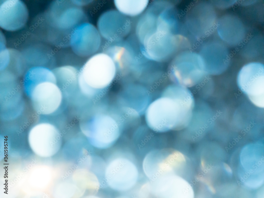 Abstract colorful blue bokeh effect texture on black background. glitter vintage lights defocused elegant for Christmas or celebrate. Sparkling magical dust particles.