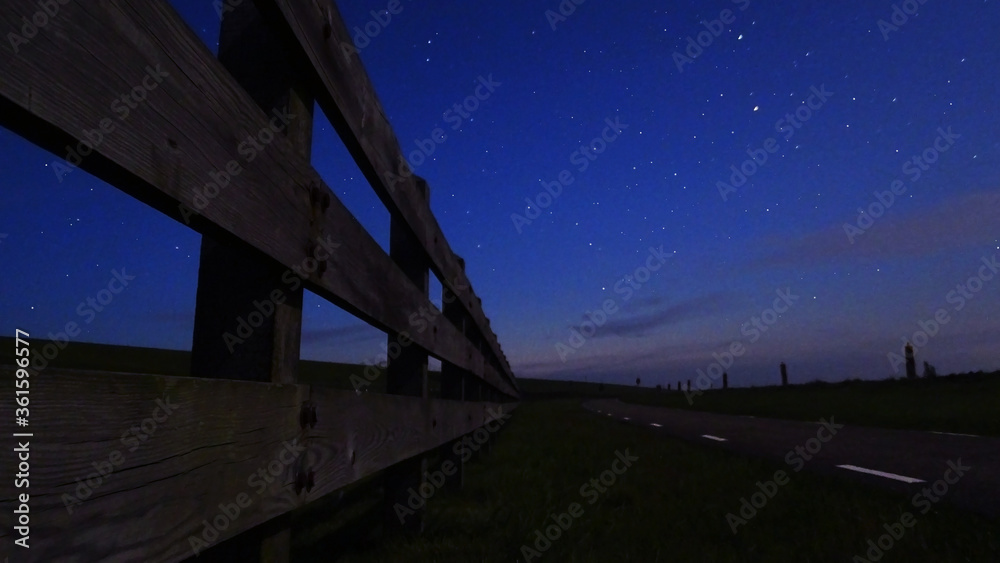 fence at night with stars fence at night with stars