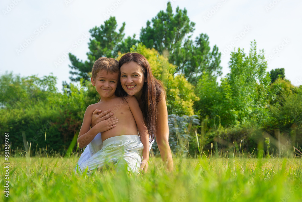 portrait of a happy mother with son outdoors