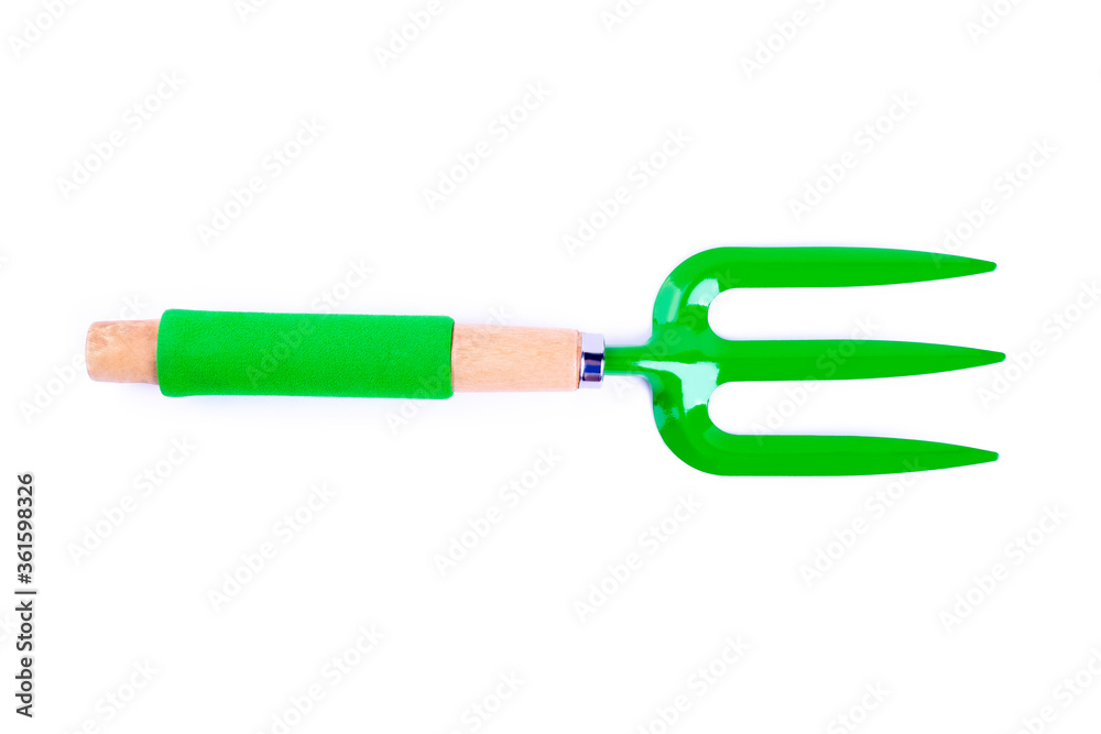 Small green garden rake isolated. Rake for small plants on white background. For planting house plants