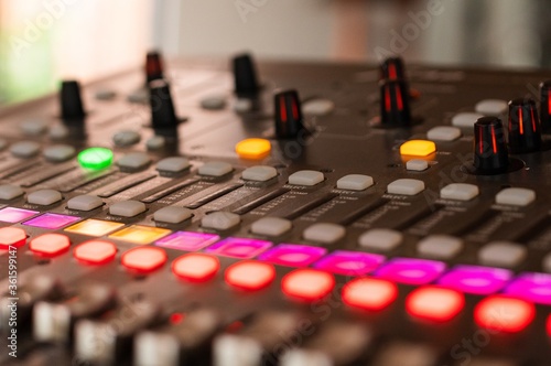 Closeup shot of a music keyboard equalizer colorful buttons photo