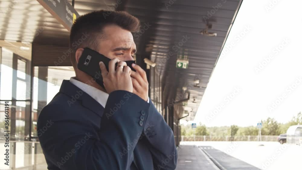 Elegant businessman in airport. Young mail entrepreneur in formalwear. Business trip and traveling. Elegant businessman in airport. Young mail entrepreneur in formalwear. Business trip and traveling.