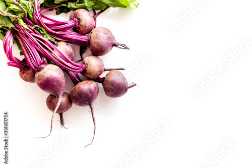 Beet - fresh, with leaves - on white table top view copy space